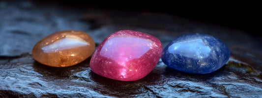 A close-up of a star stone gemstone showing radiant starry inclusions.