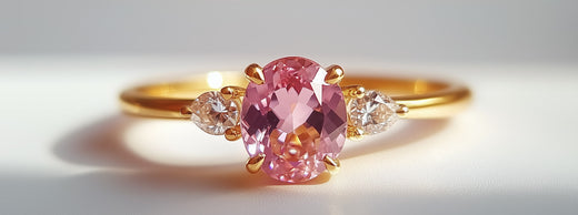 Engagement ring with pink diamonds and gold band