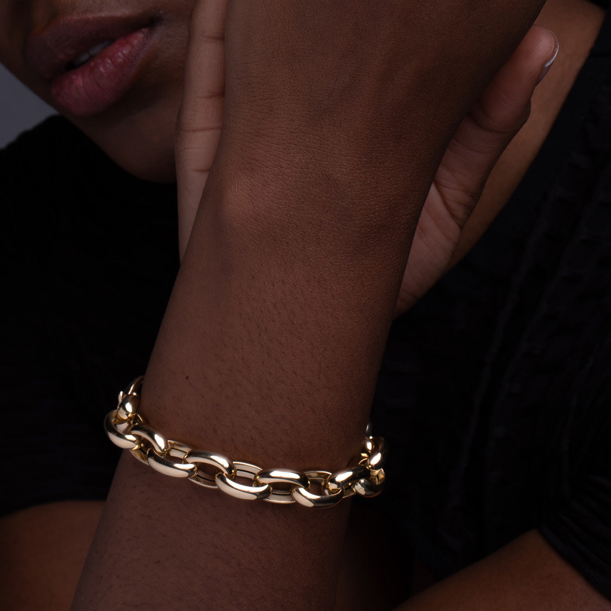 Model Wearing Open Link Gold Bracelet