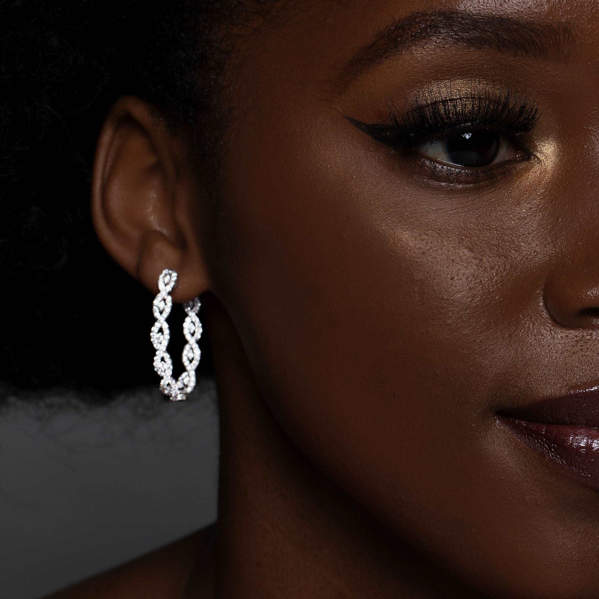 Model Wearing Intertwined Diamond Hoop White Gold Earrings
