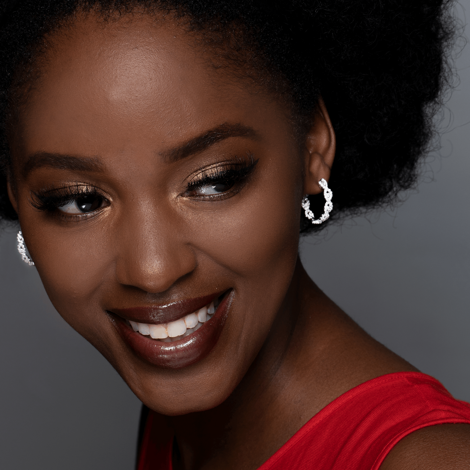 Model Wearing Diamond Intertwined White Gold Small Hoop Earrings