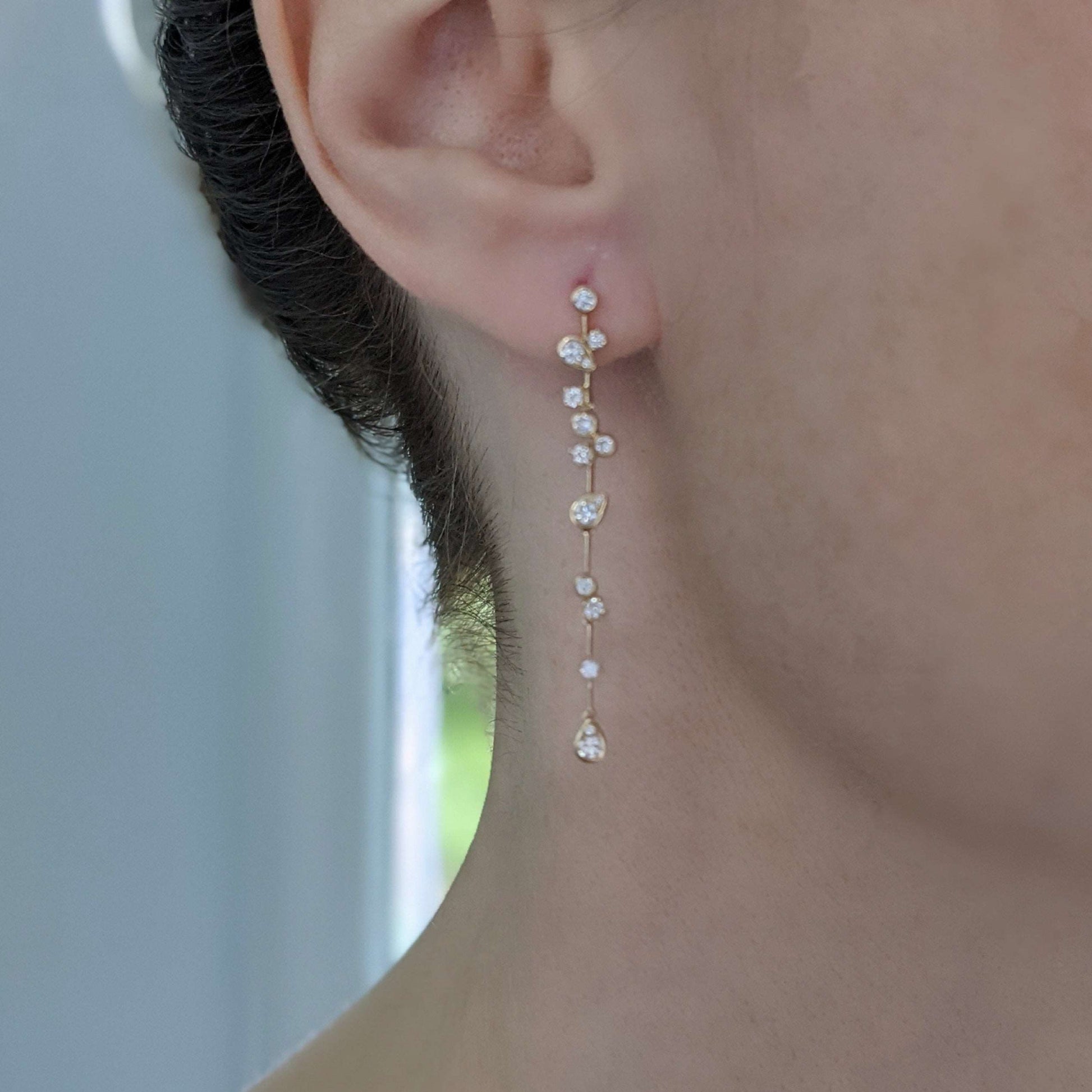Model Wearing Diamond Gold Dangle Earrings