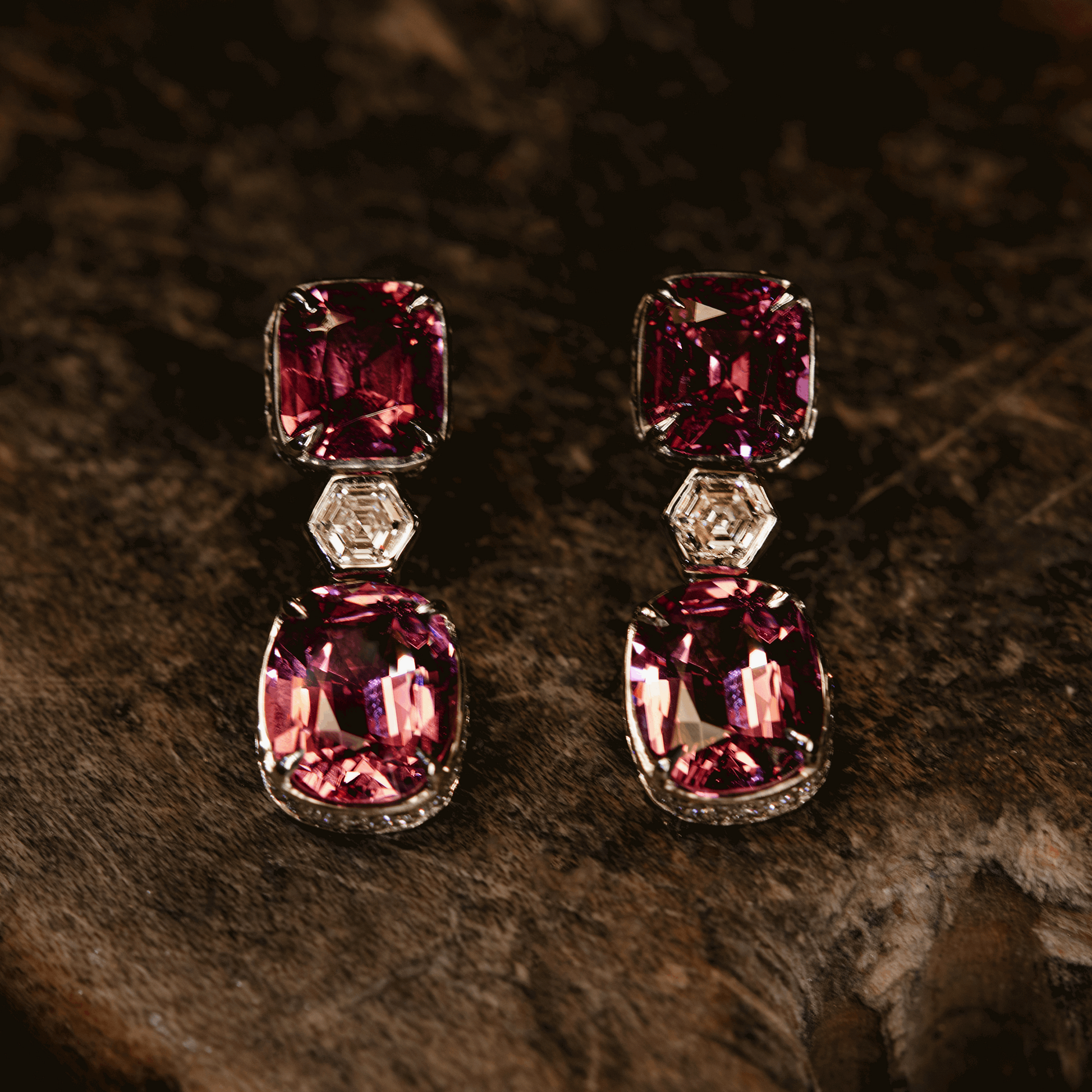 Pink Spinel Diamond Gold Earrings on a wooden table