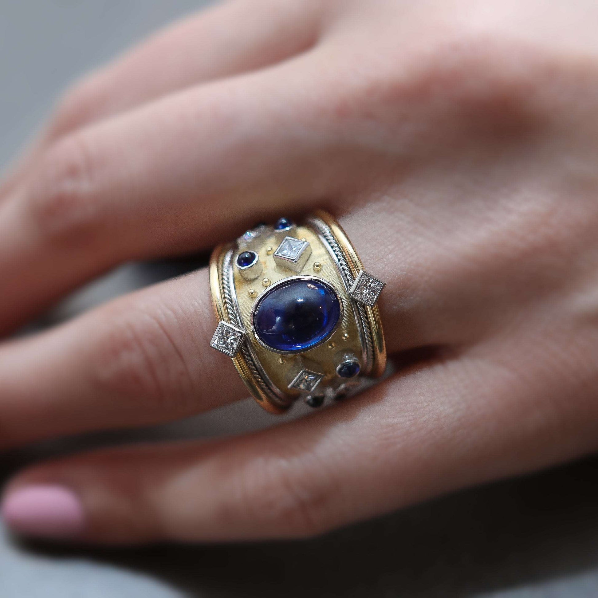 Model Wearing Royal Blue Sapphire Platinum Ring