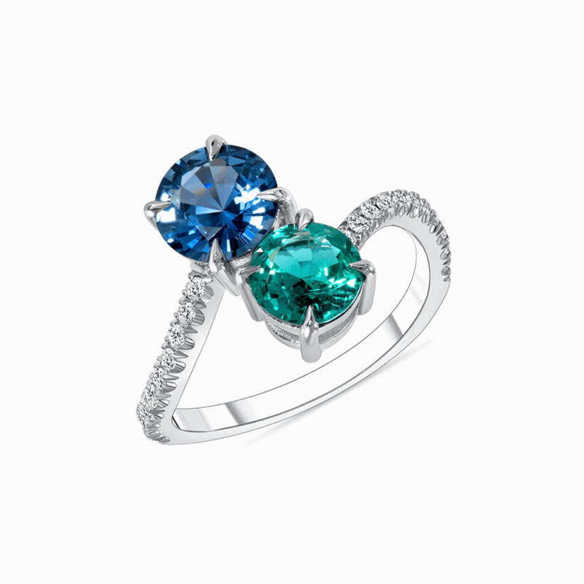 Toi-et-Moi Emerald & Sapphire Gold Ring on a white background