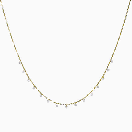 Floating Diamonds Necklace in Yellow Gold on a white background