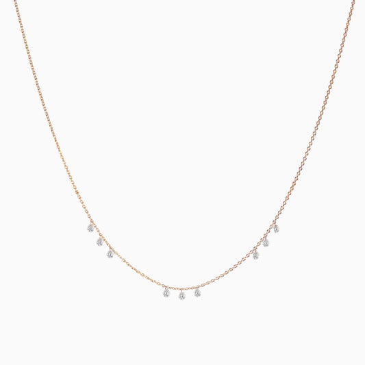 Floating Nine Diamonds Necklace in Rose Gold on a white background