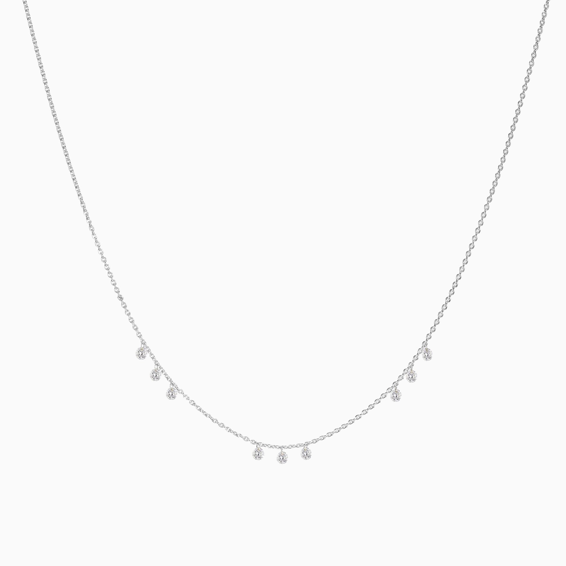 Floating Nine Diamonds Necklace in White Gold on a white background