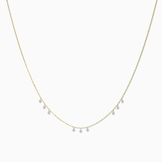 Floating Nine Diamonds Necklace in Yellow Gold on a white background