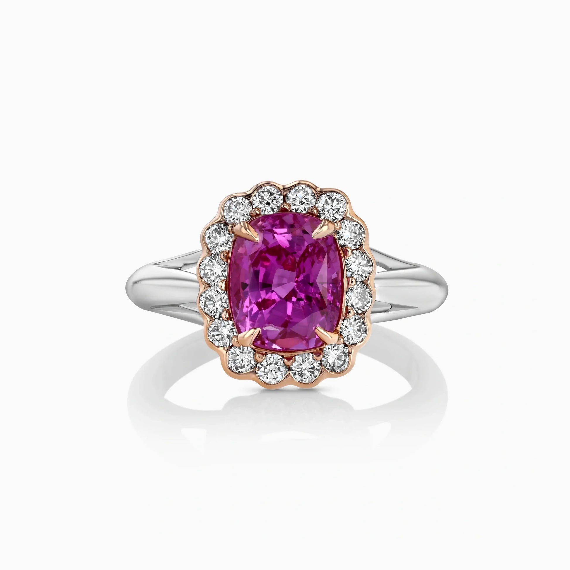 Intense Pink Sapphire & Diamonds Gold Ring on a white background