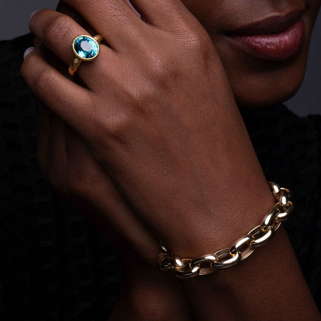 Model Wearing Open Link Gold Bracelet