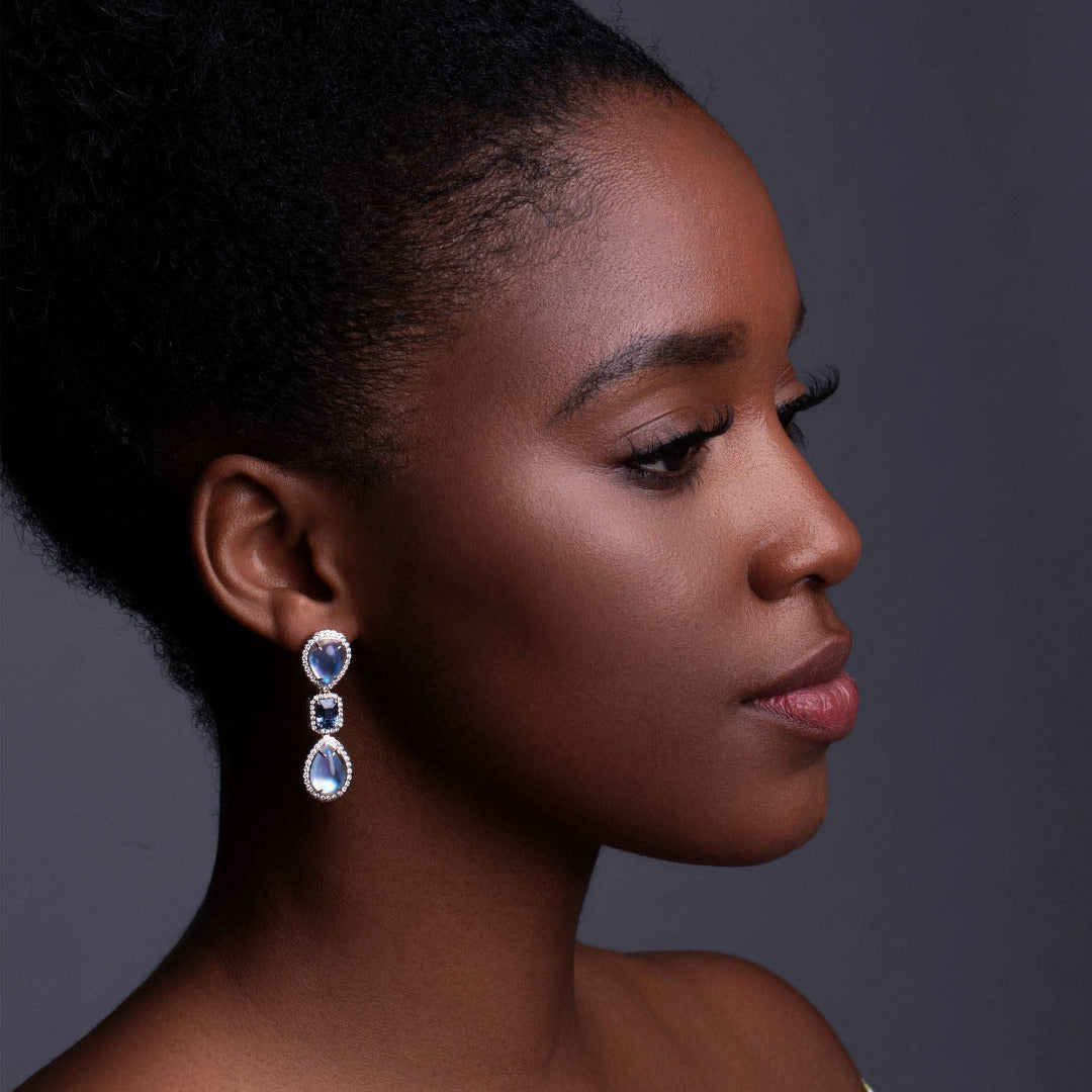 A model wearing Moonstone and Sapphire Drop Earrings