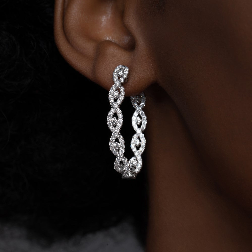 Model Wearing Intertwined Diamond Hoop White Gold Earrings