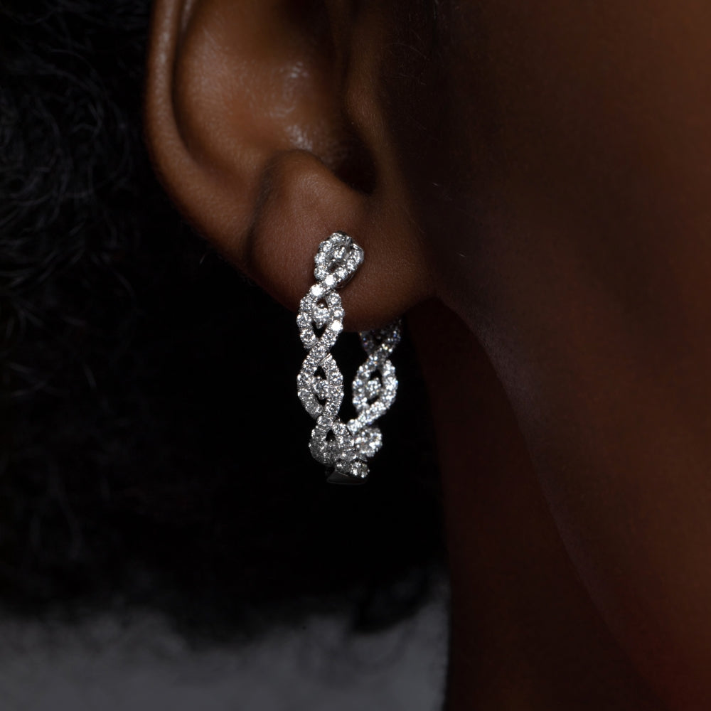 Close-up of Diamond Intertwined White Gold Small Hoop Earrings