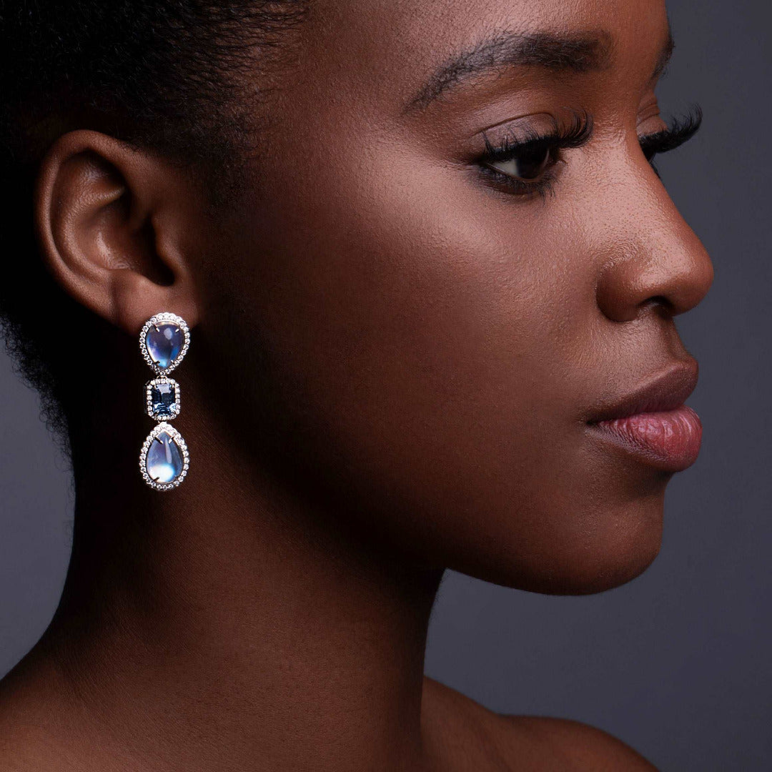 A model wearing Moonstone and Sapphire Drop Earrings
