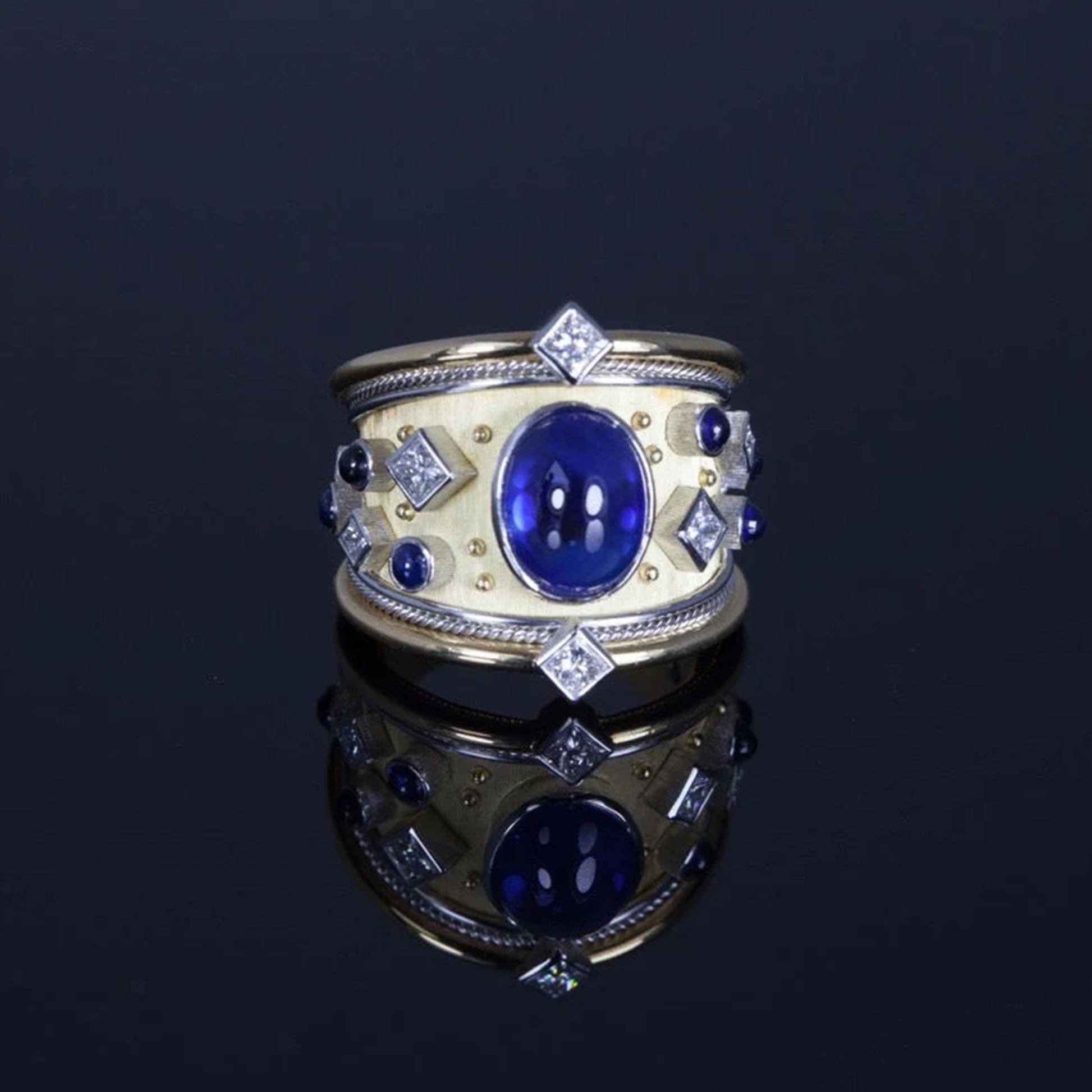 Royal Blue Sapphire Platinum Ring on a black background 