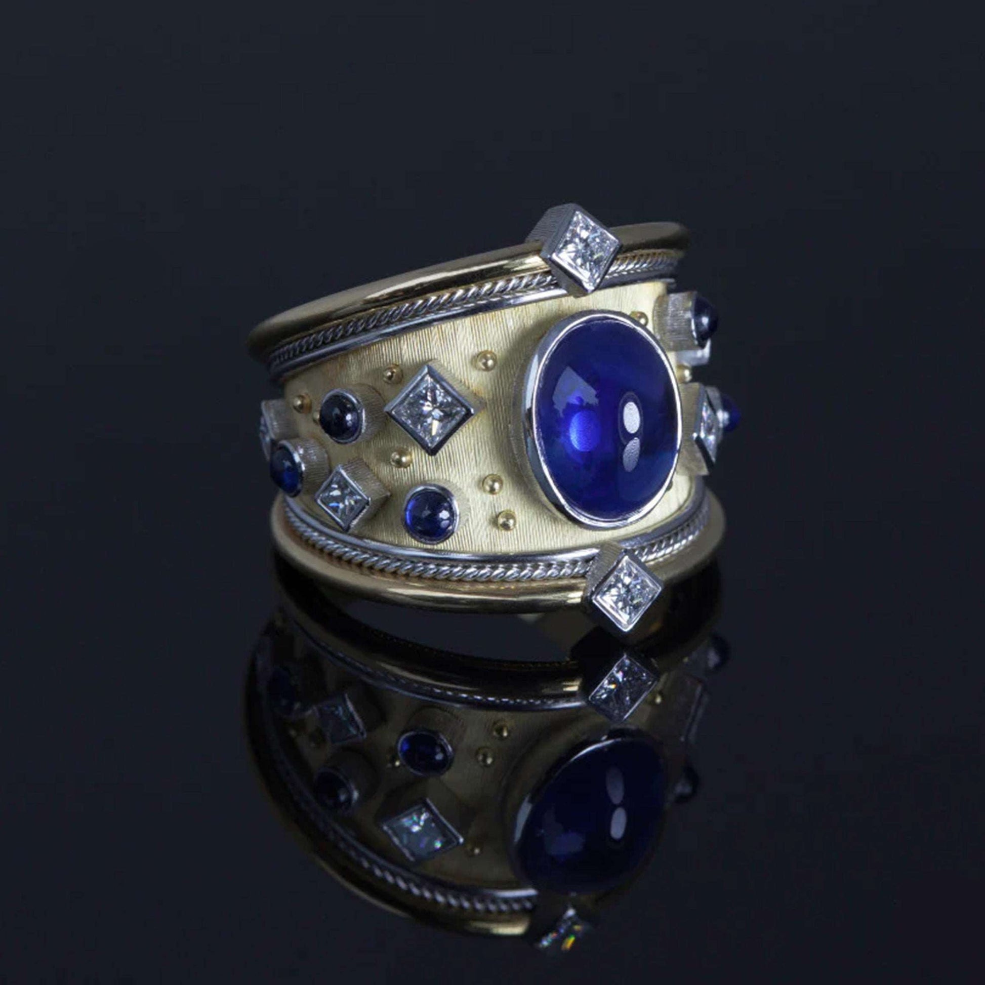 Royal Blue Sapphire Platinum Ring on a black background