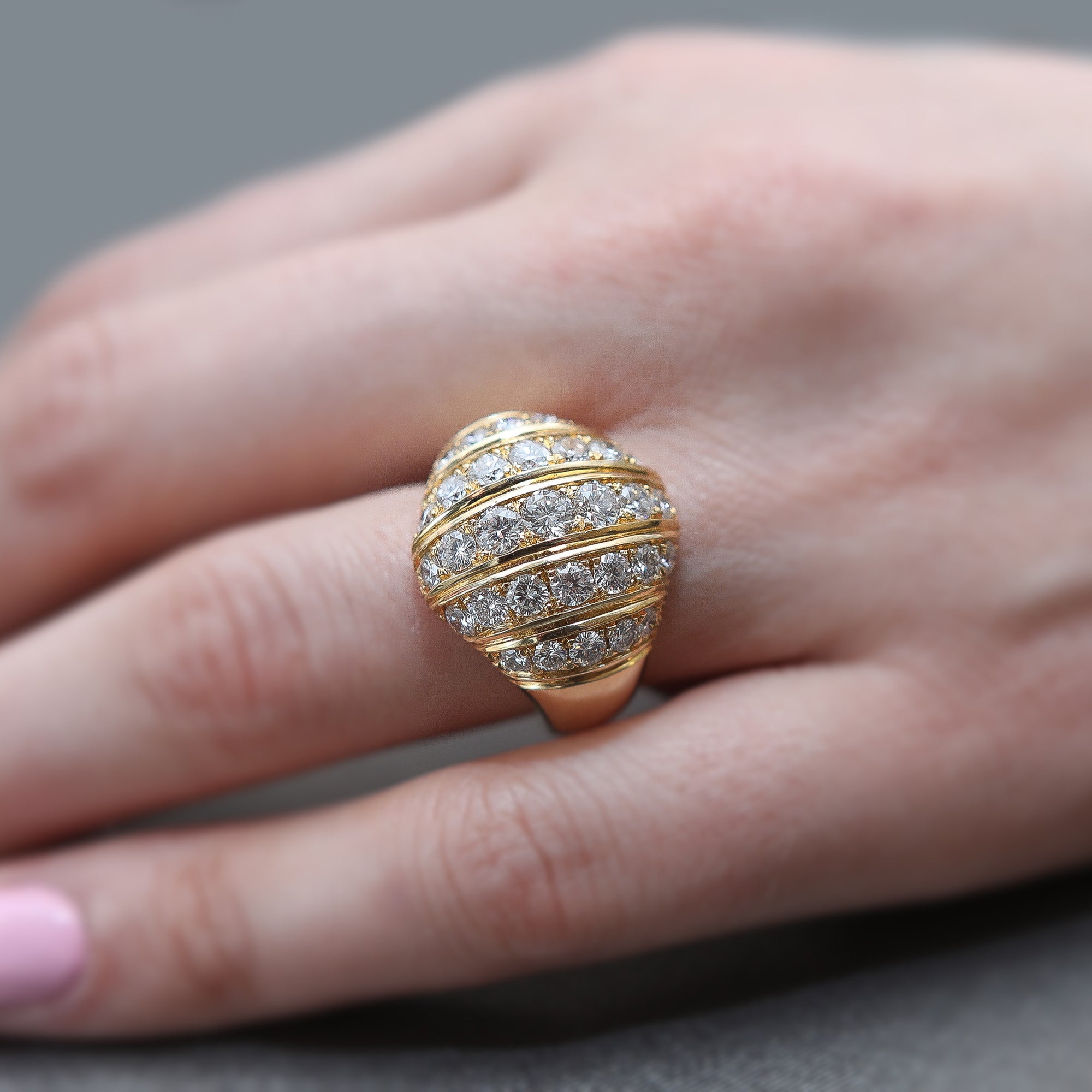 A yellow gold ring with diamonds set in vertical rows, part of the Etruscan Revival Collection