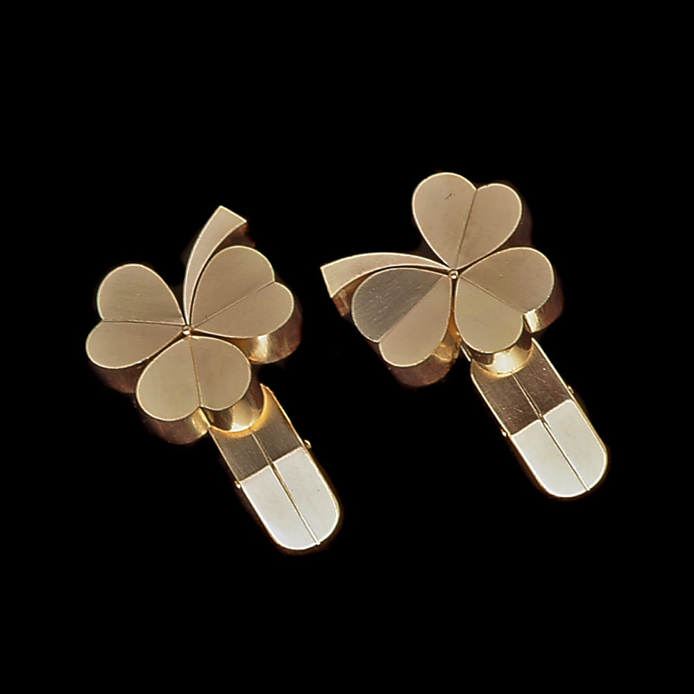 Clover Heart Leaf Gold Cuff Links on a black background
