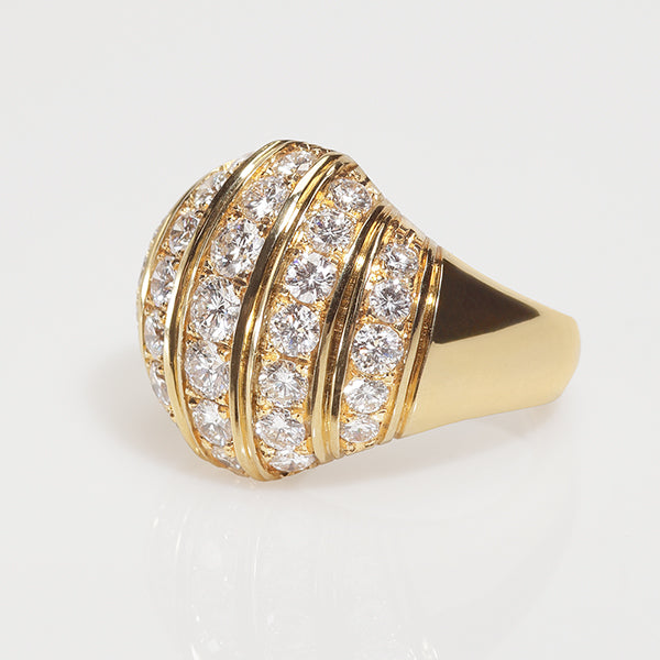 A yellow gold ring with diamonds set in vertical rows, part of the Etruscan Revival Collection