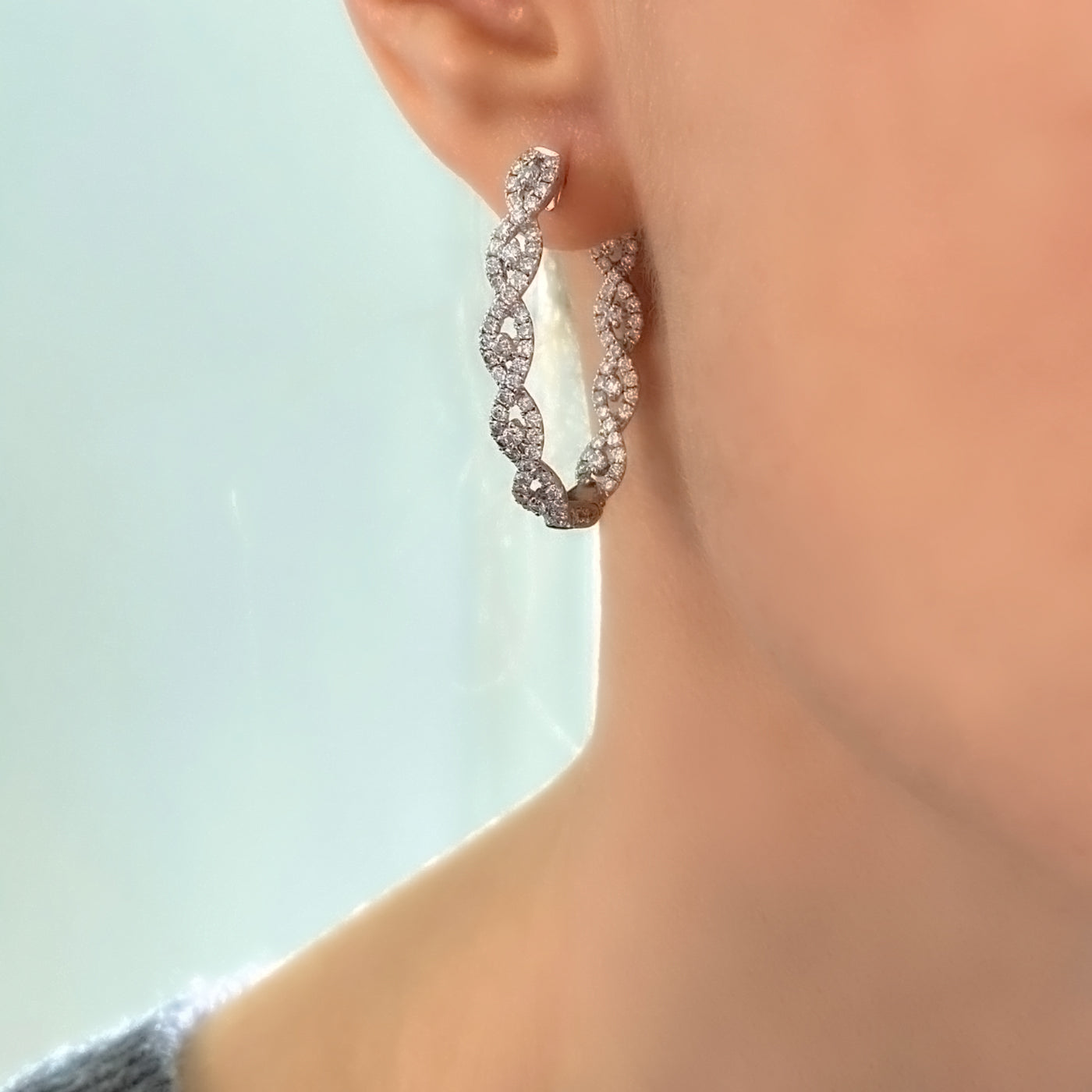 Model Wearing Intertwined Diamond Hoop White Gold Earrings