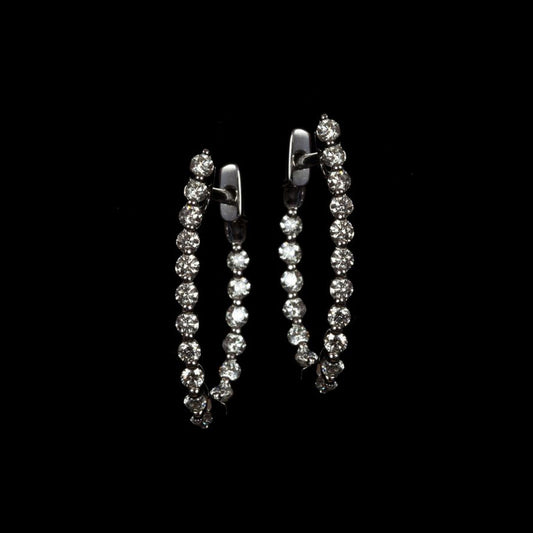 Diamond Hoop Earrings in 18k White Gold on a black background