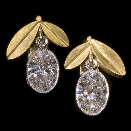 Olivia Diamond Earrings in 18k Yellow Gold on a black background